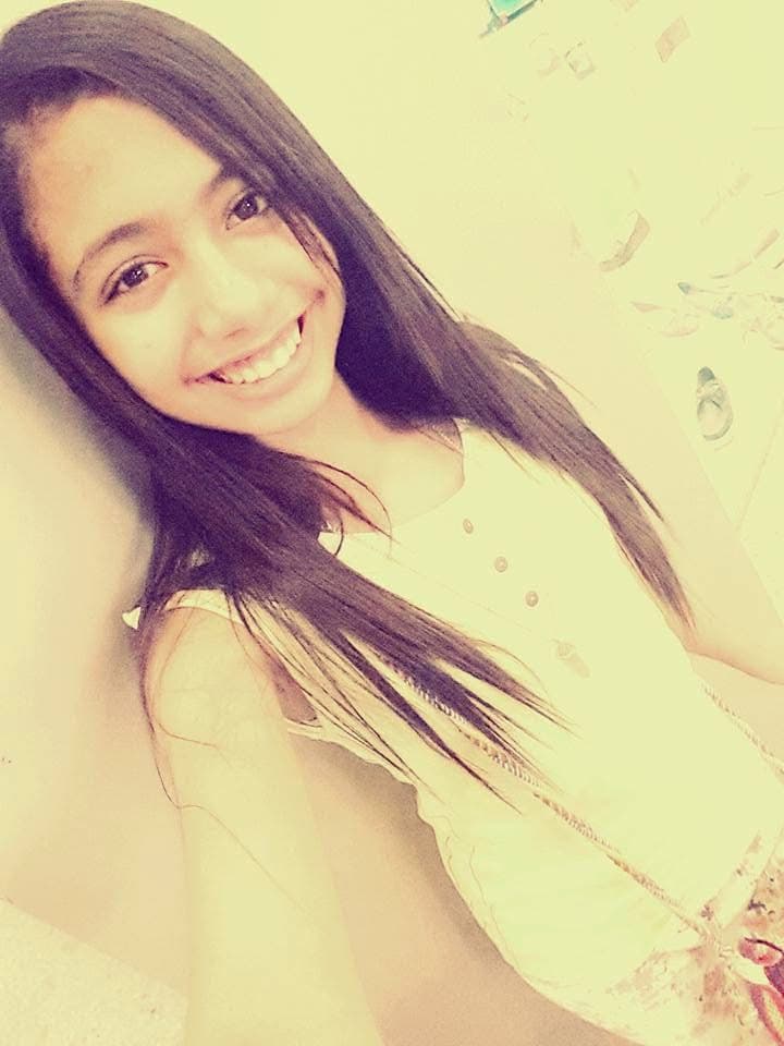 Magda in 2015, hair straightened with heat