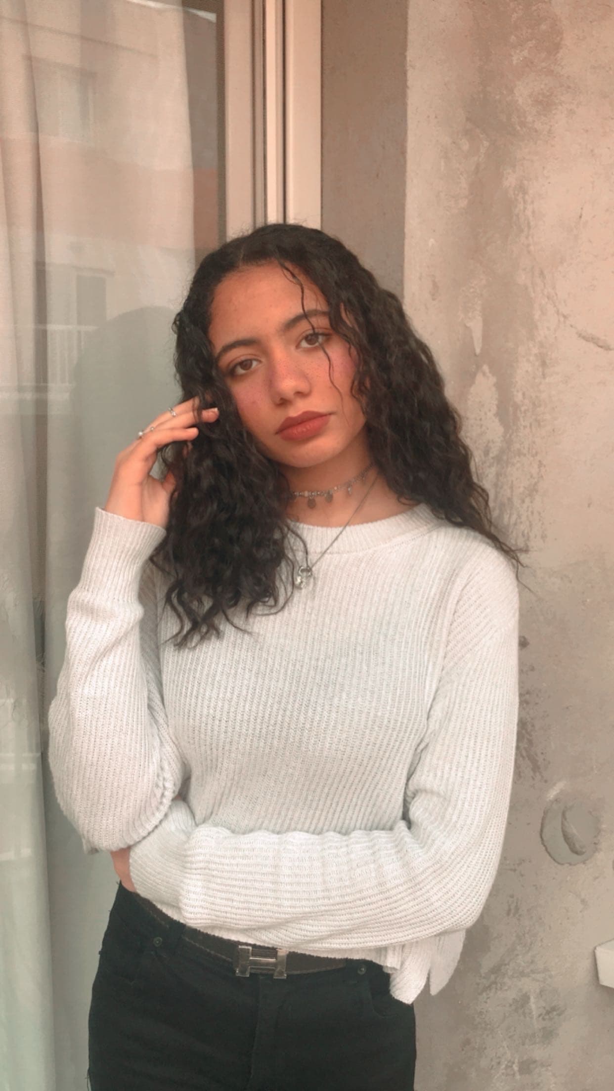 Magda in 2019, heat-damaged hair starting to show its curl pattern